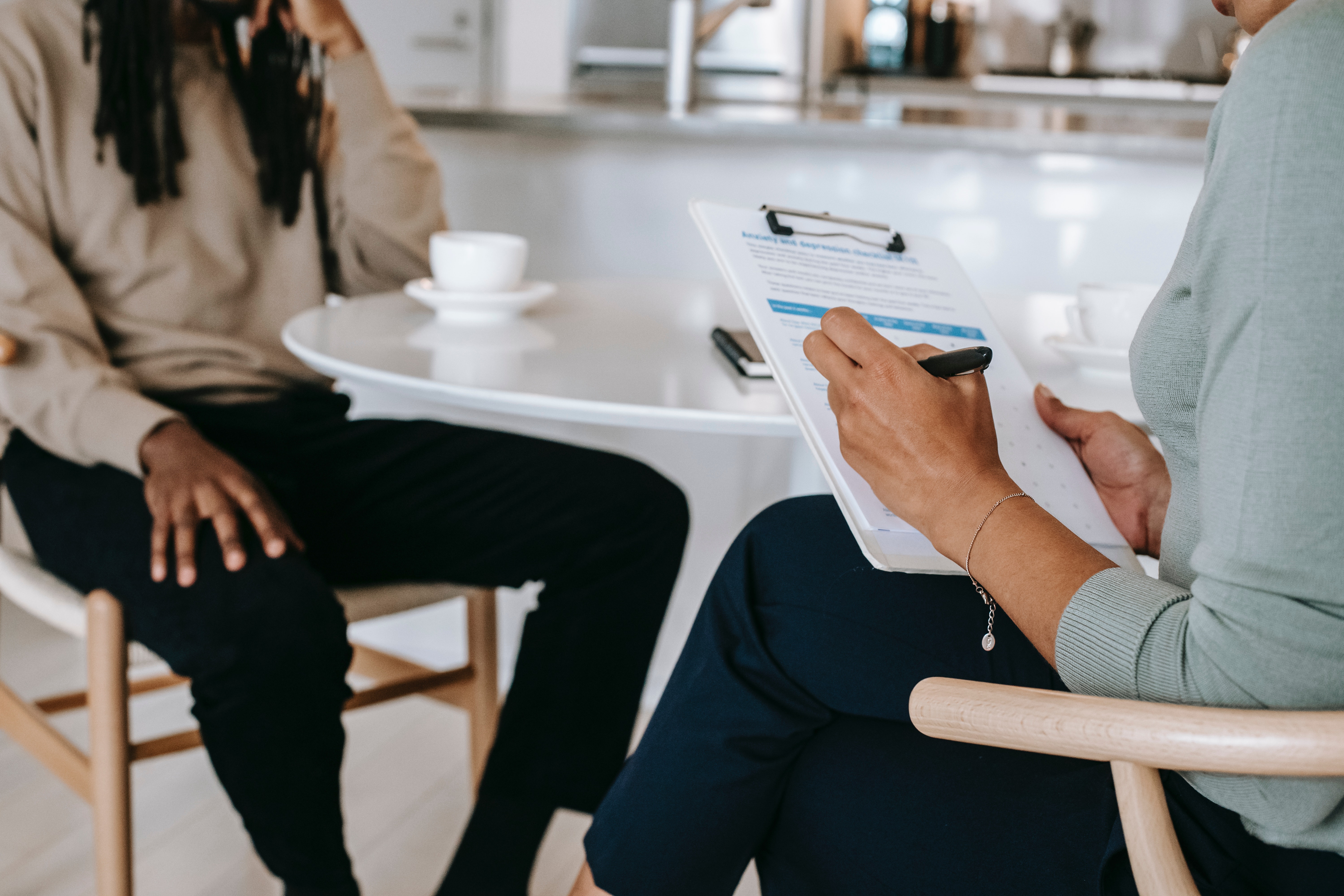 Two people sitting at a table interviewing